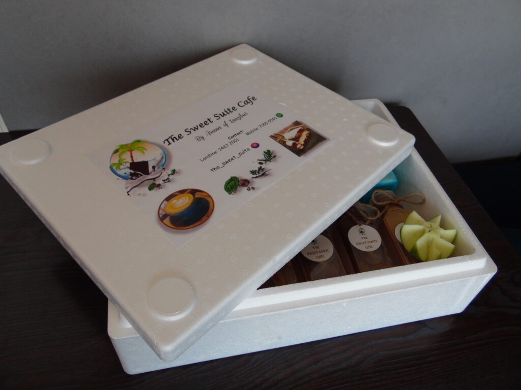 white styrofoam box with 12 bottles of mixed flavors of juices, cold coffees, and shakes